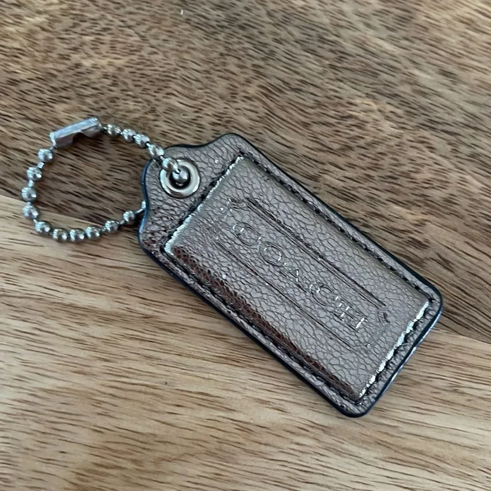 Metallic silver - Coach Stamped Leather Hang Tag